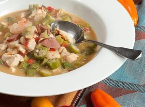 chicken seafood gumbo in white bowl; recipe from northwest kidney centers