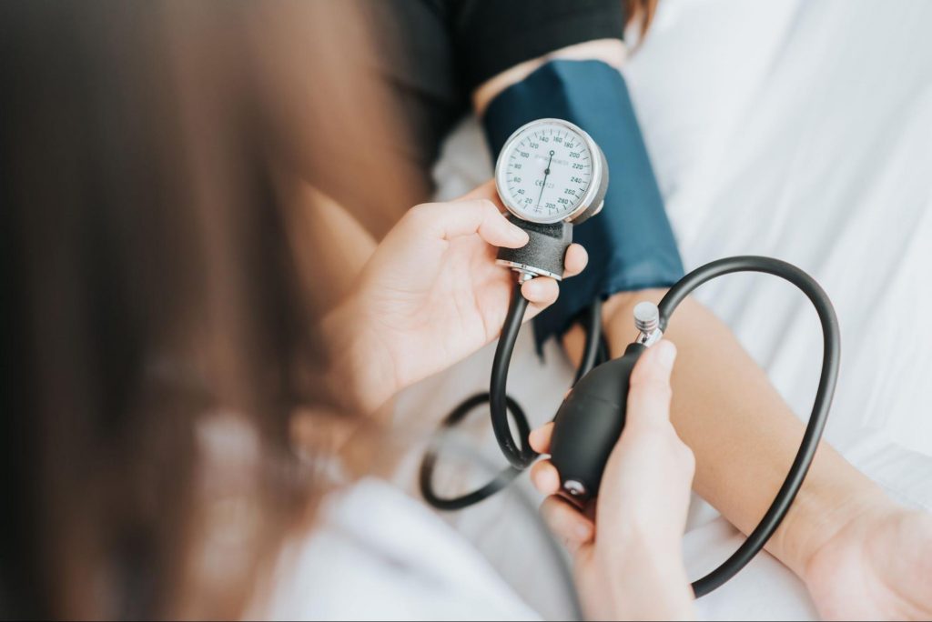 A person getting their blood pressure taken to represent Most Commonly Asked Blood Pressure Questions